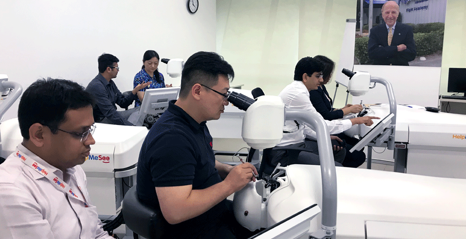 Medical trainees engaging in a simulation-based cataract surgery training