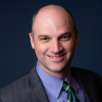Portrait of Mike Vercio speaking about simulation-based surgical training.